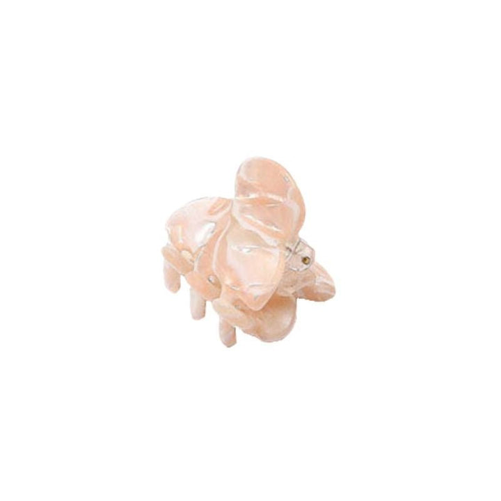 The SOHO Hara Mini Hair Claw in Cloud Pink from SOHO is a small, glossy, elephant-shaped hair accessory resembling a figurine, displayed on a white background.